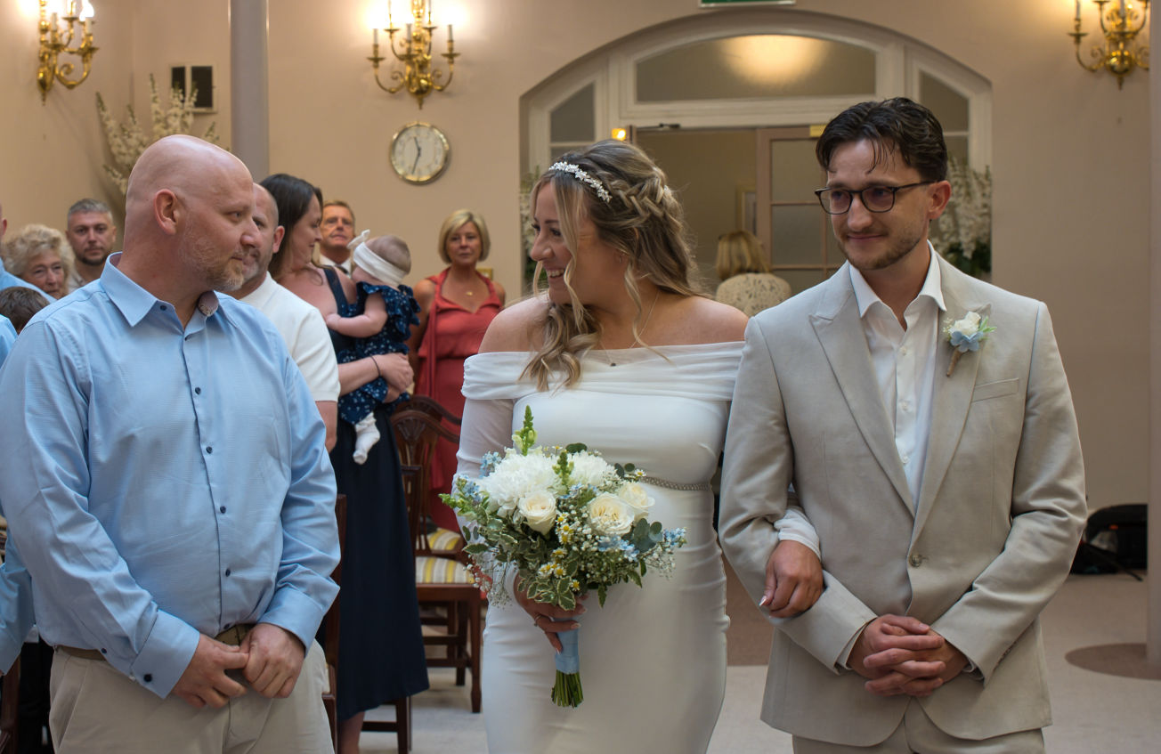 Groom sees his bride for the first time at Stockport registry office