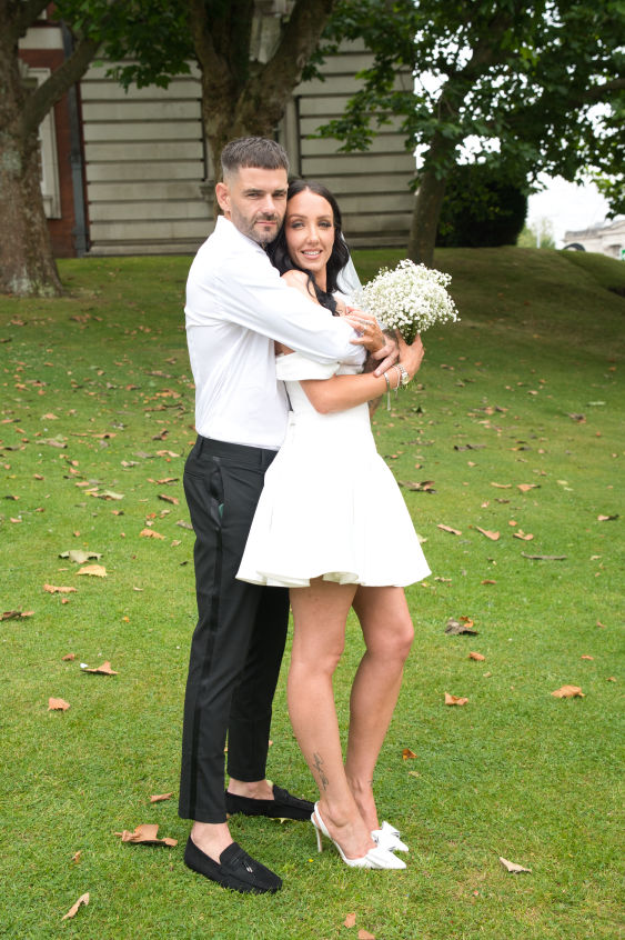 The bride  and groom outside Stockport Registry Office  after tying the knot. 